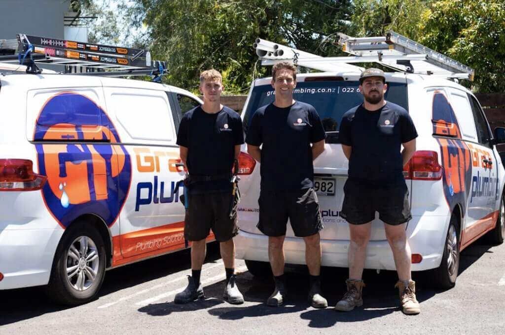 The Grace Plumbing team with their vans