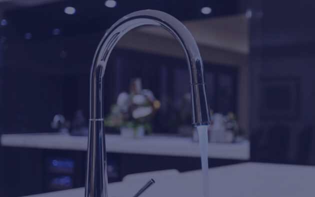 Sleek and Simple Water Tap That is Producing Running Water.