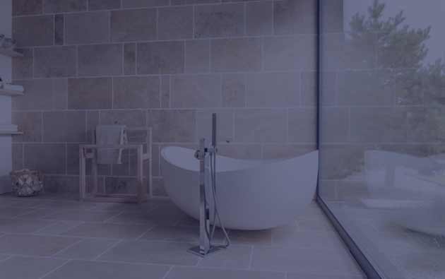 Standing Bathtub in the Middle of a Room by a Pane of Glass.